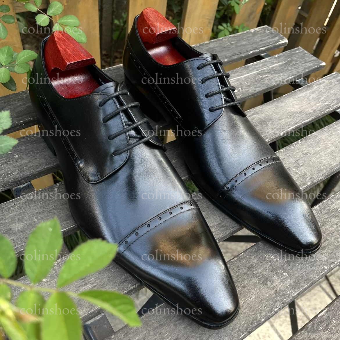 Left angled view showing detailed toe stitching and sleek leather texture-Colinshoes