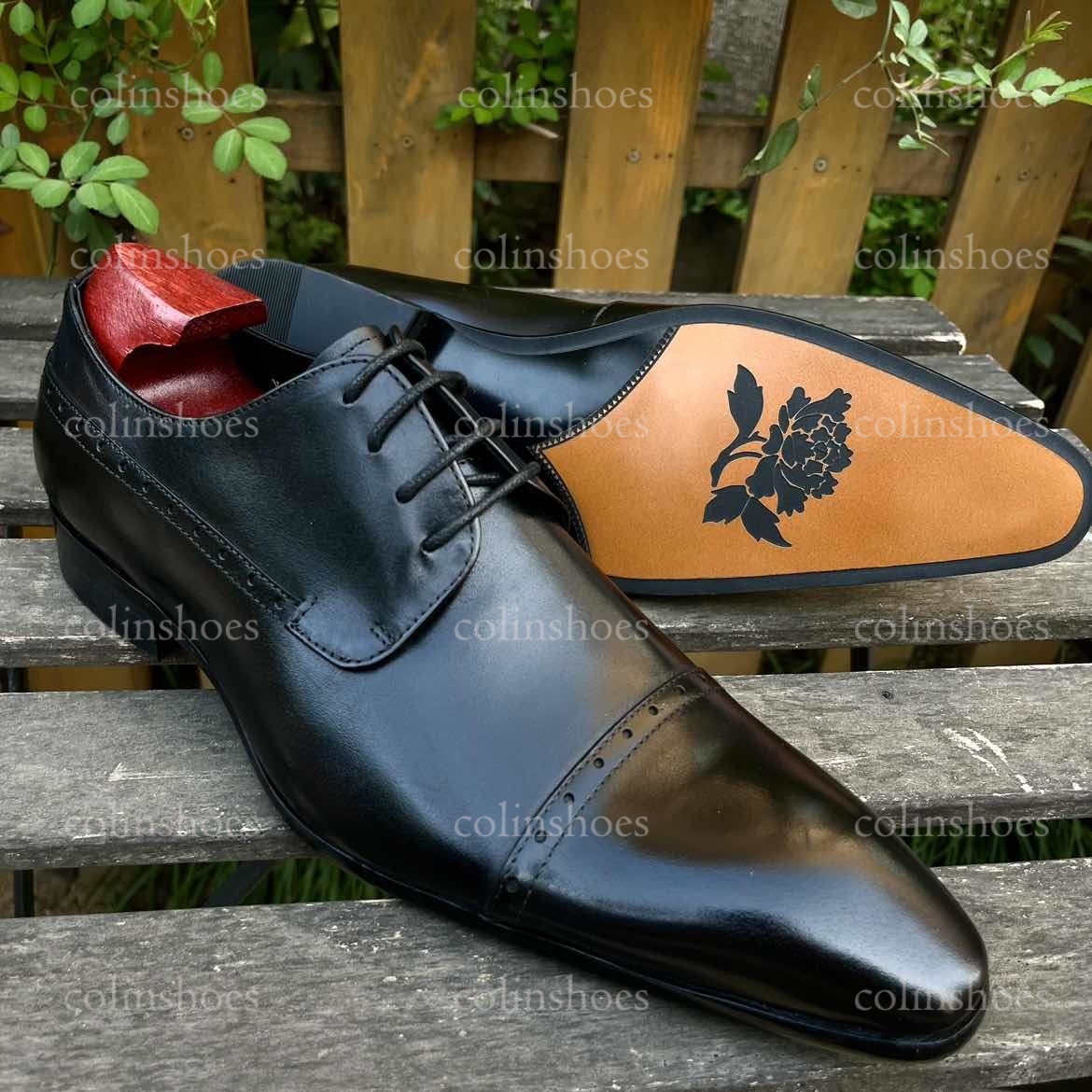 Close-up of floral engraved sole artwork and polished leather finish-Colinshoes