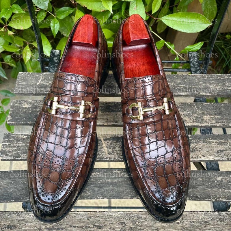 embossed leather loafers with horsebit buckle and brogue toe