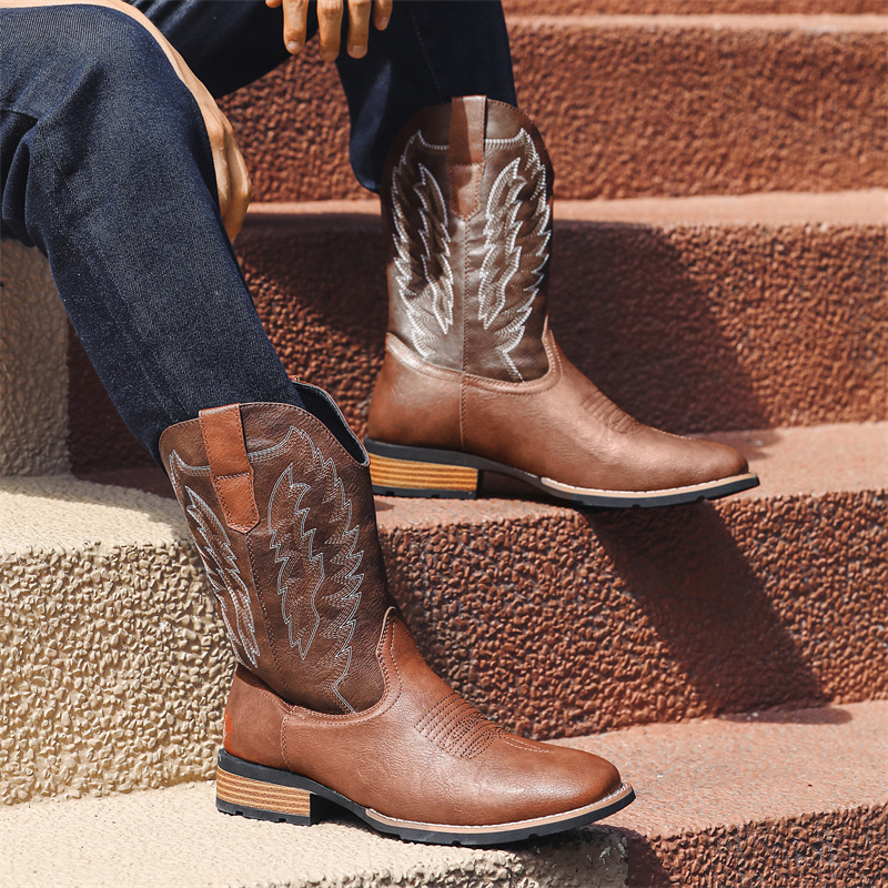 Angled left-side view of men’s brown Western cowboy boots with stitching details