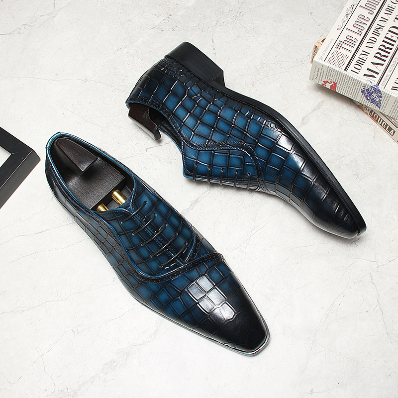 Close-up of embossed pattern and patina color depth on oxford toe.