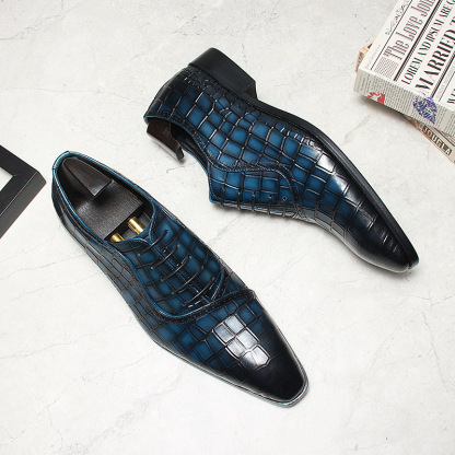 Close-up of embossed pattern and patina color depth on oxford toe.