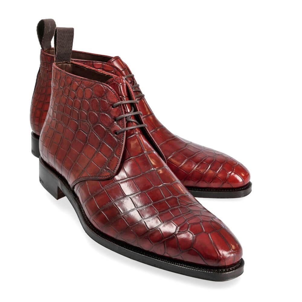 Left angled view of high-shine embossed gator leather ankle boots-Colinshoes