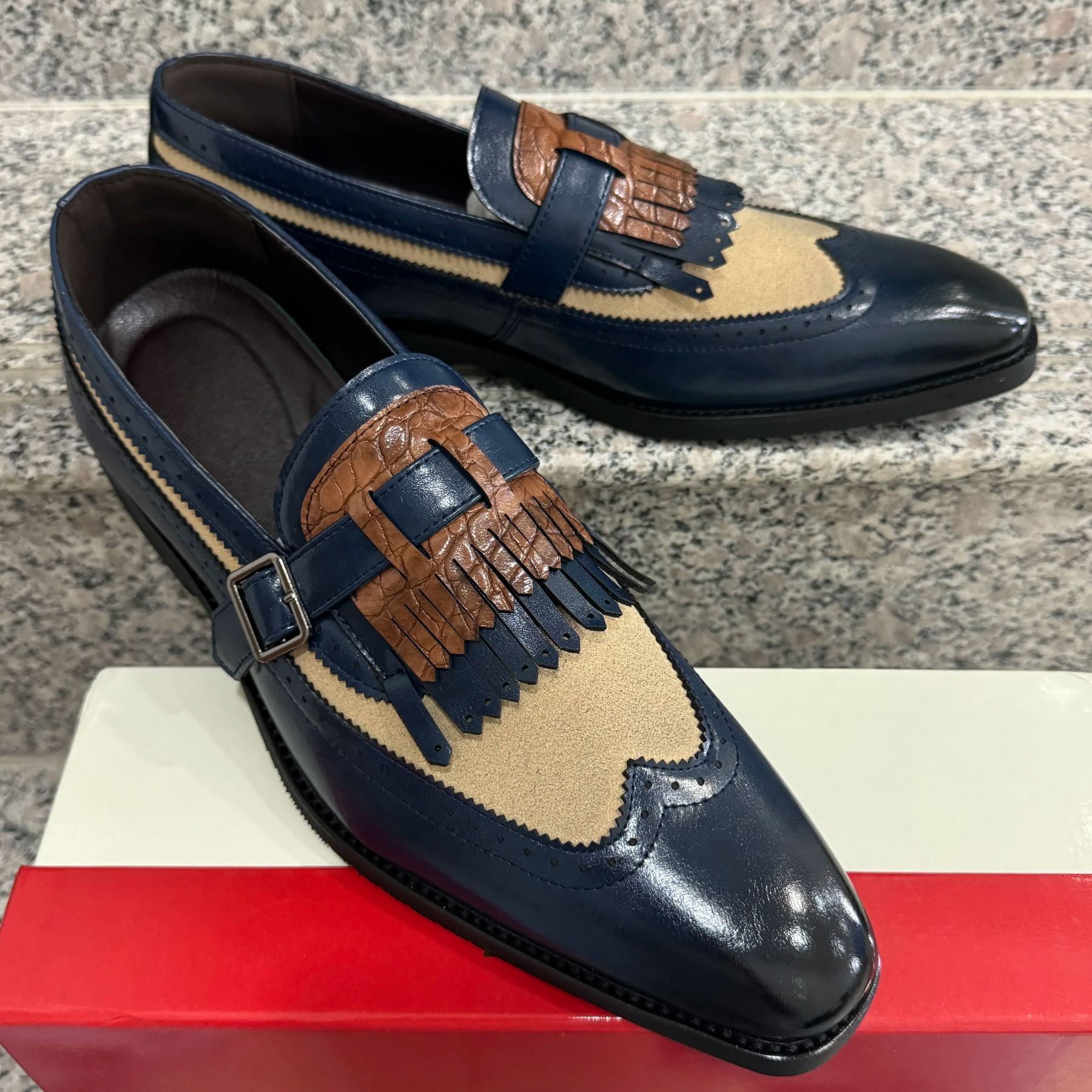 Left angled view of men’s white tassel dress shoes on pavement-Colinshoes