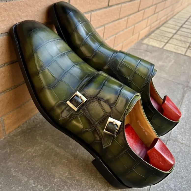 Close-up of crocodile embossed leather and buckle design-Colinshoes