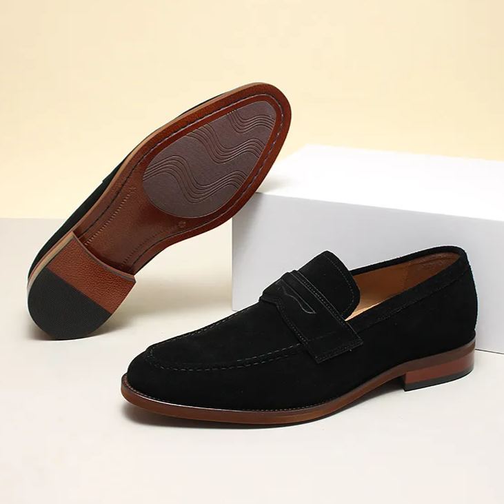 Rear angle showing the low stacked heel and durable leather sole finish-Colinshoes