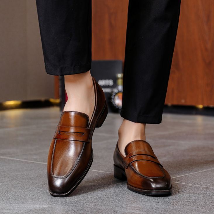 Men’s brown leather penny loafers side view
