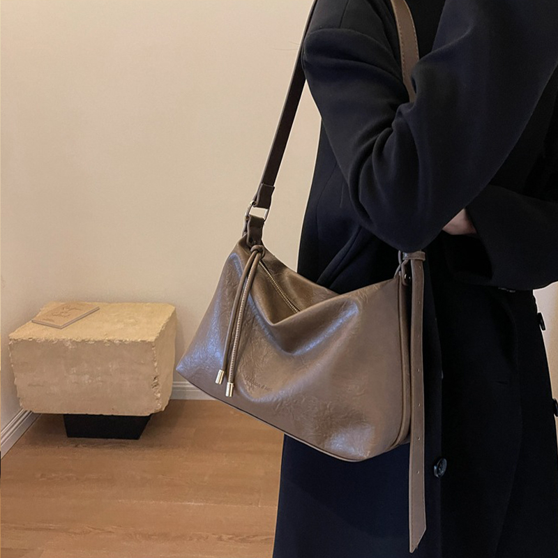 時尚韓系綁帶設計感斜背包女通勤單肩包百搭潮流軟皮腋下包