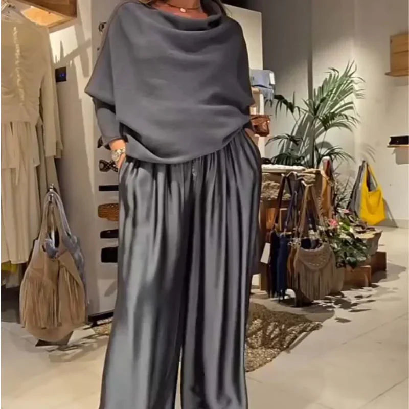 Elegáns, váll nélküli felső és bő szárú szatén nadrág, kétrészes szett