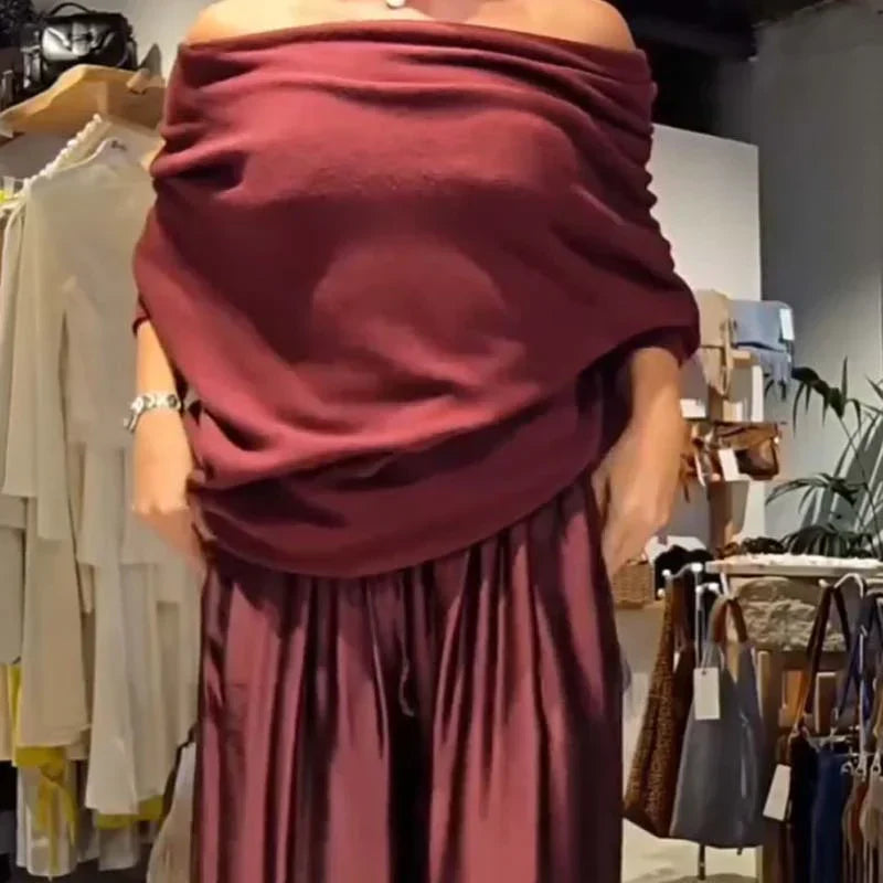 Elegáns, váll nélküli felső és bő szárú szatén nadrág, kétrészes szett