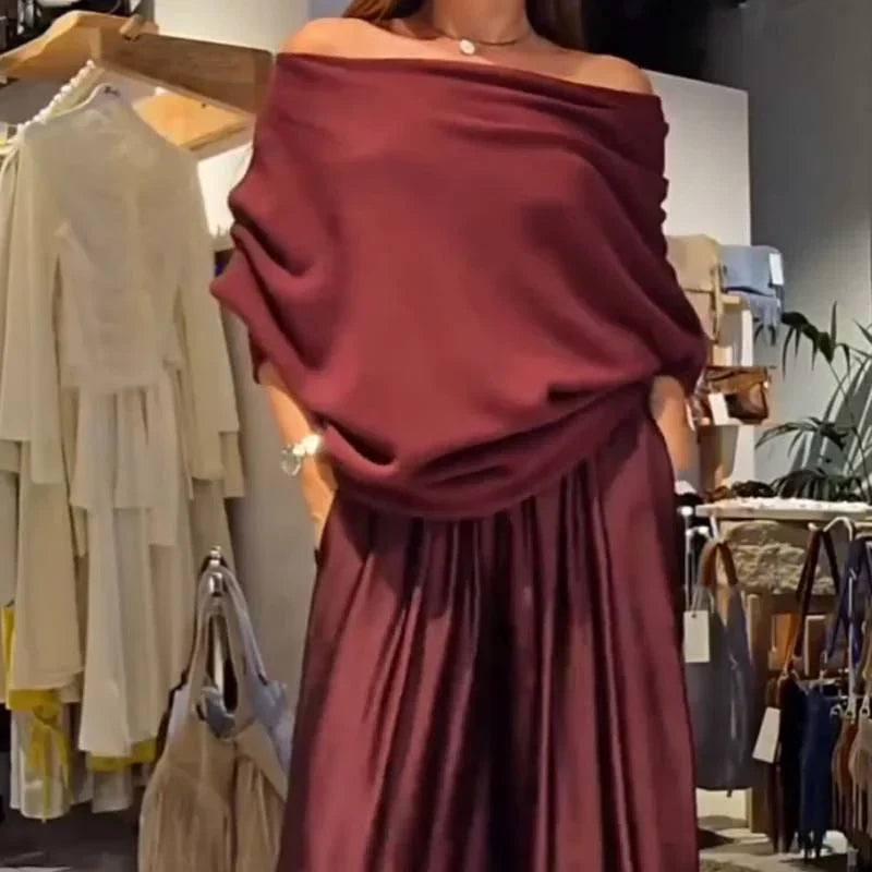 Elegáns, váll nélküli felső és bő szárú szatén nadrág, kétrészes szett