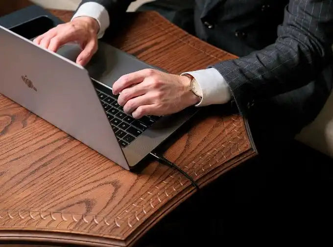 Silver laptop with black keyboard.