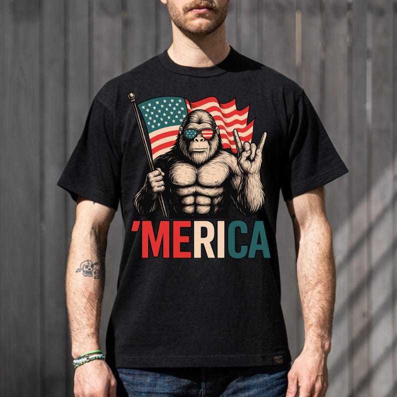 T - Shirt with a Fun Twist: Iconic Bigfoot Figure Holding Flag
