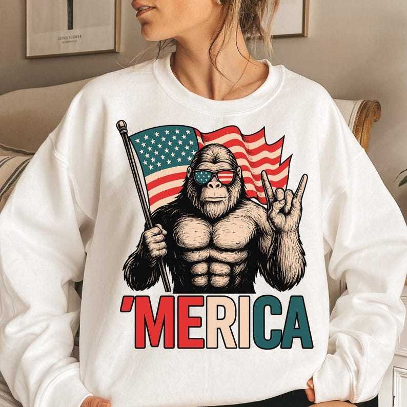 T - Shirt with a Fun Twist: Iconic Bigfoot Figure Holding Flag