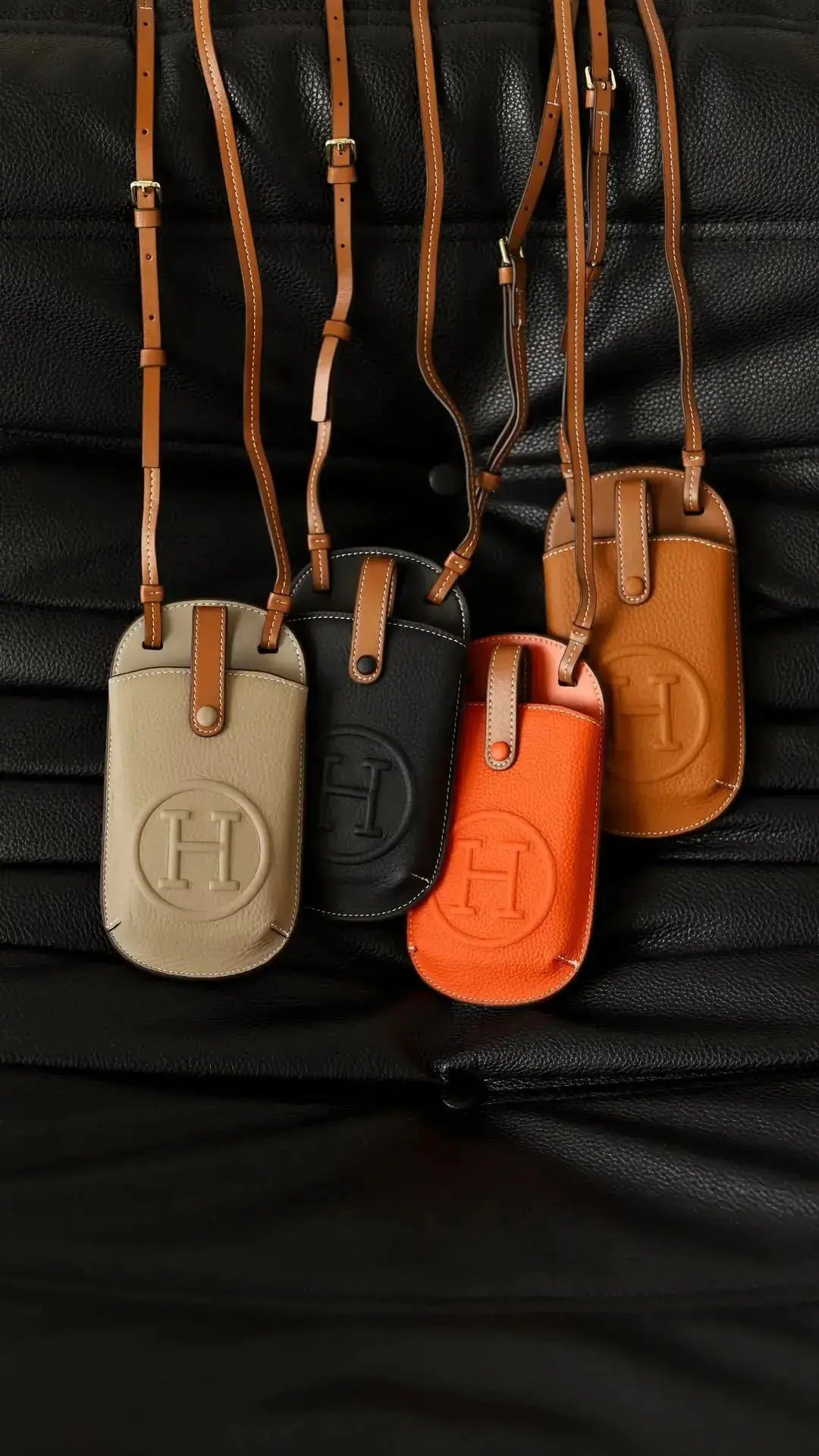 An elegant Herm&egrave;s-inspired leather iPhone 17 Pro Max case, showcasing iconic craftsmanship and a cardholder.