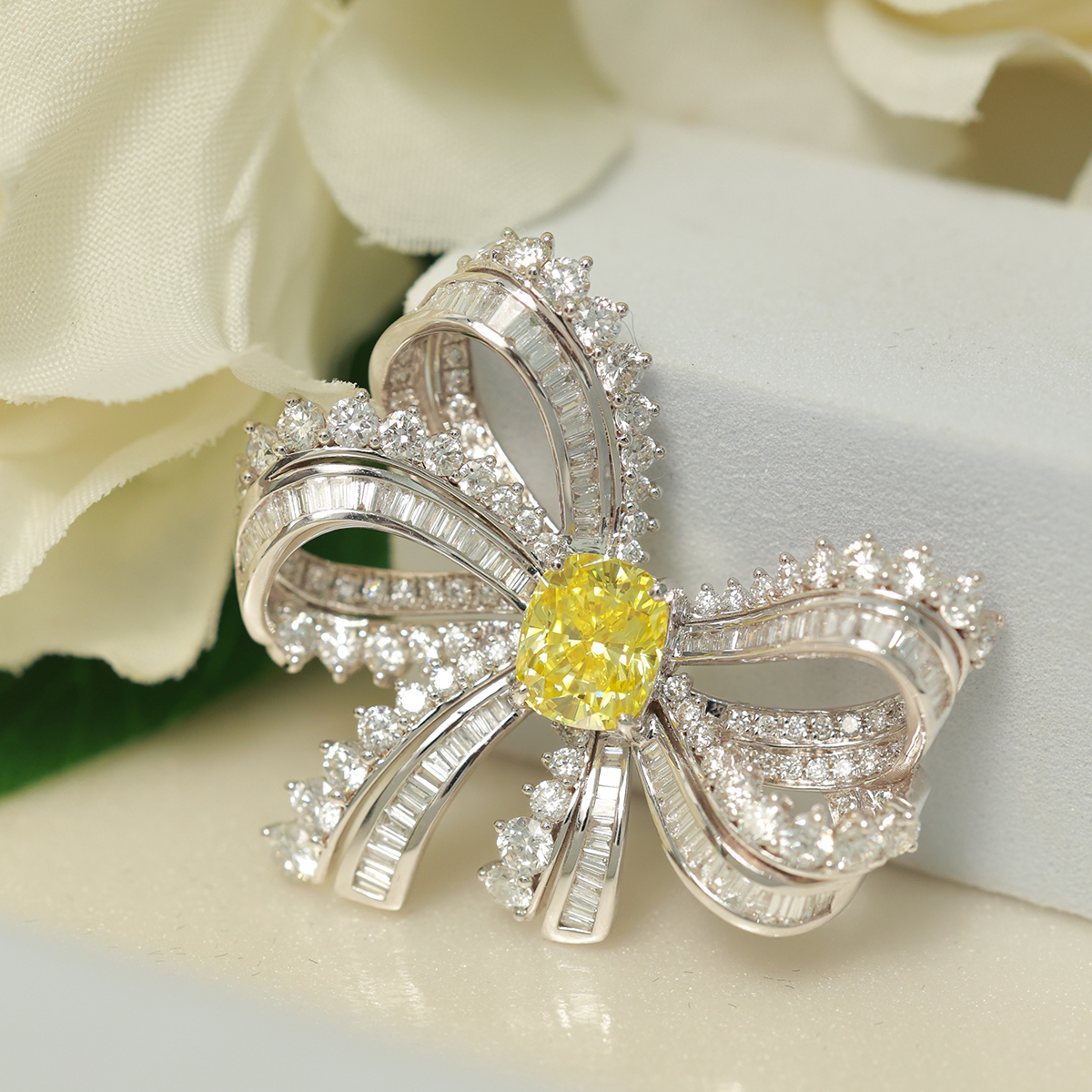 2 Carat Center Stone Yellow Cushion Cut Lab Grown Diamond with White Baguette Diamond Ribbon Bow Brooch (5.2 Ct Tw)-Light Mark