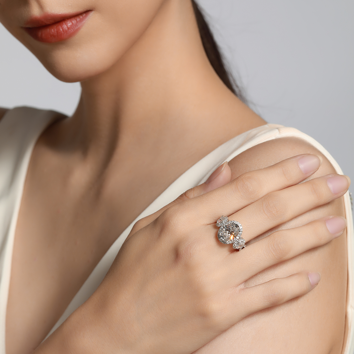 3 Carat Oval Cut Lab Grown Diamond Halo Three Stone Engagement Ring in 18k White Gold (4 Ct. Tw.)