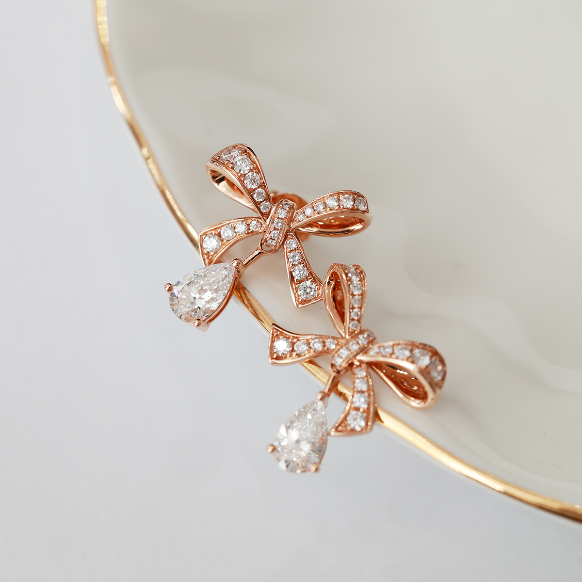 1.2 Carat Total Elegant Diamond Ribbon Bow with Pear Cut Drop Diamond Stud Earring in 18k Rose Gold 