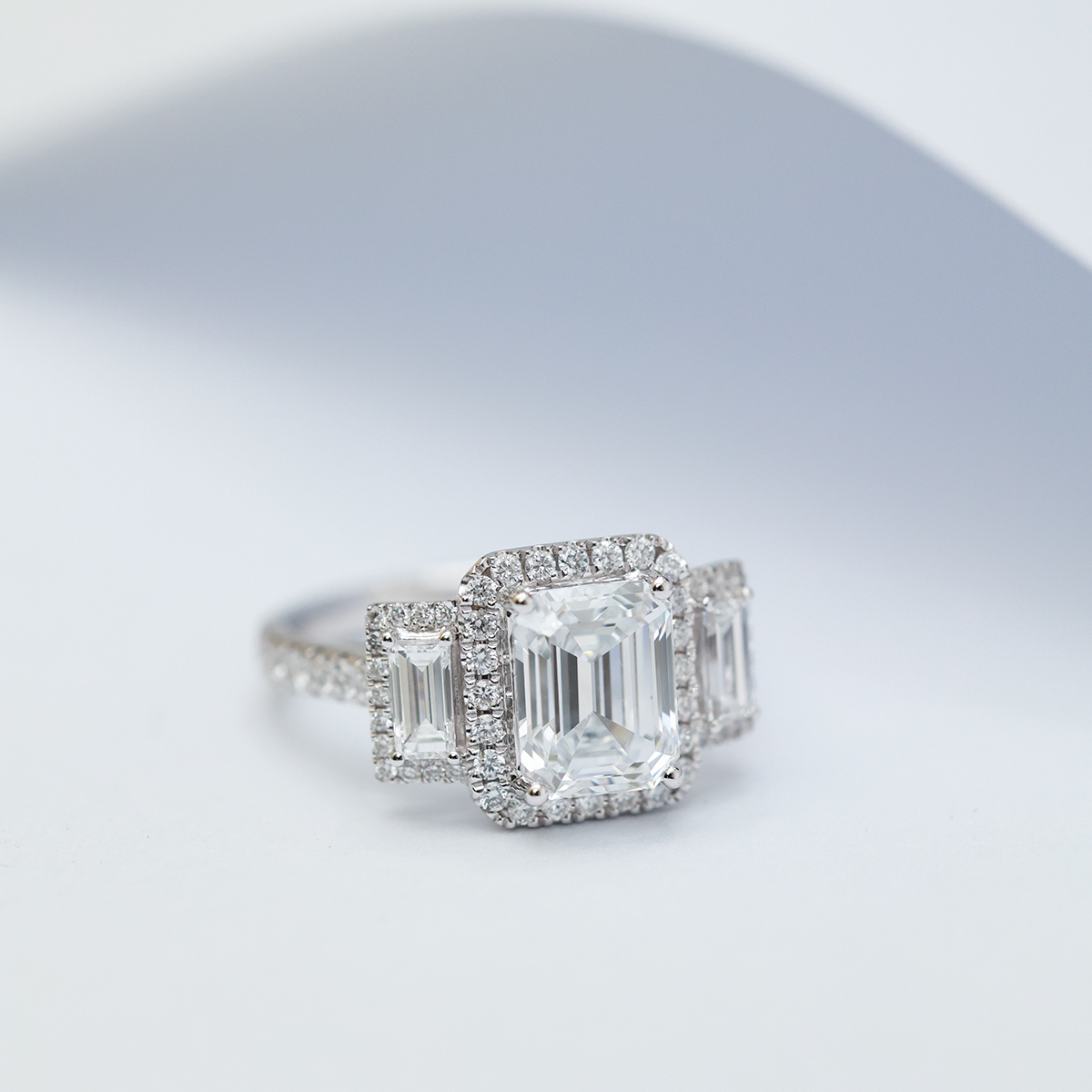 2.5 Carat Center Stone Three Stone Halo Emerald Cut Lab Grown Diamond Engagement Ring (3.4 Ct Tw) -Light Mark