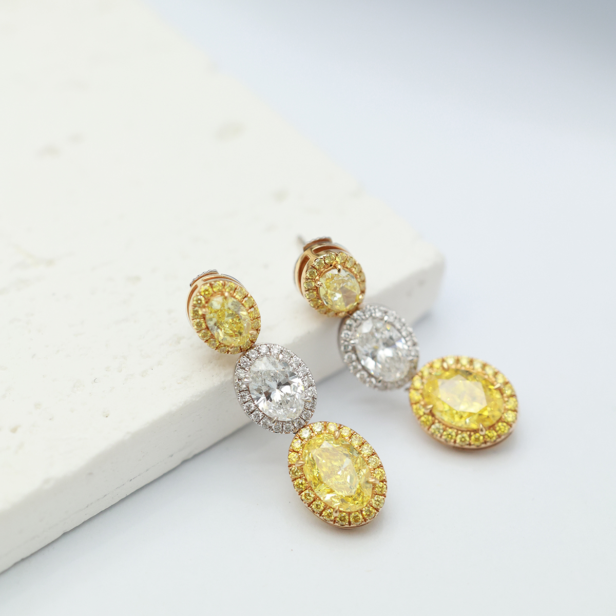 4.4 Carat Total Weight Halo Oval Three Stone Yellow and White Lab Grown Diamond Drop Earrings-Light Mark
