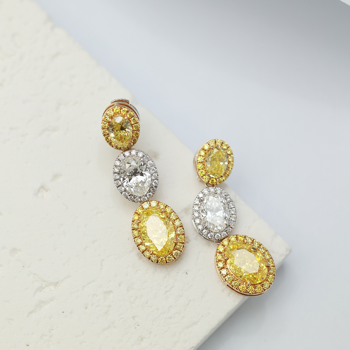 4.4 Carat Total Weight Halo Oval Three Stone Yellow and White Lab Grown Diamond Drop Earrings-Light Mark