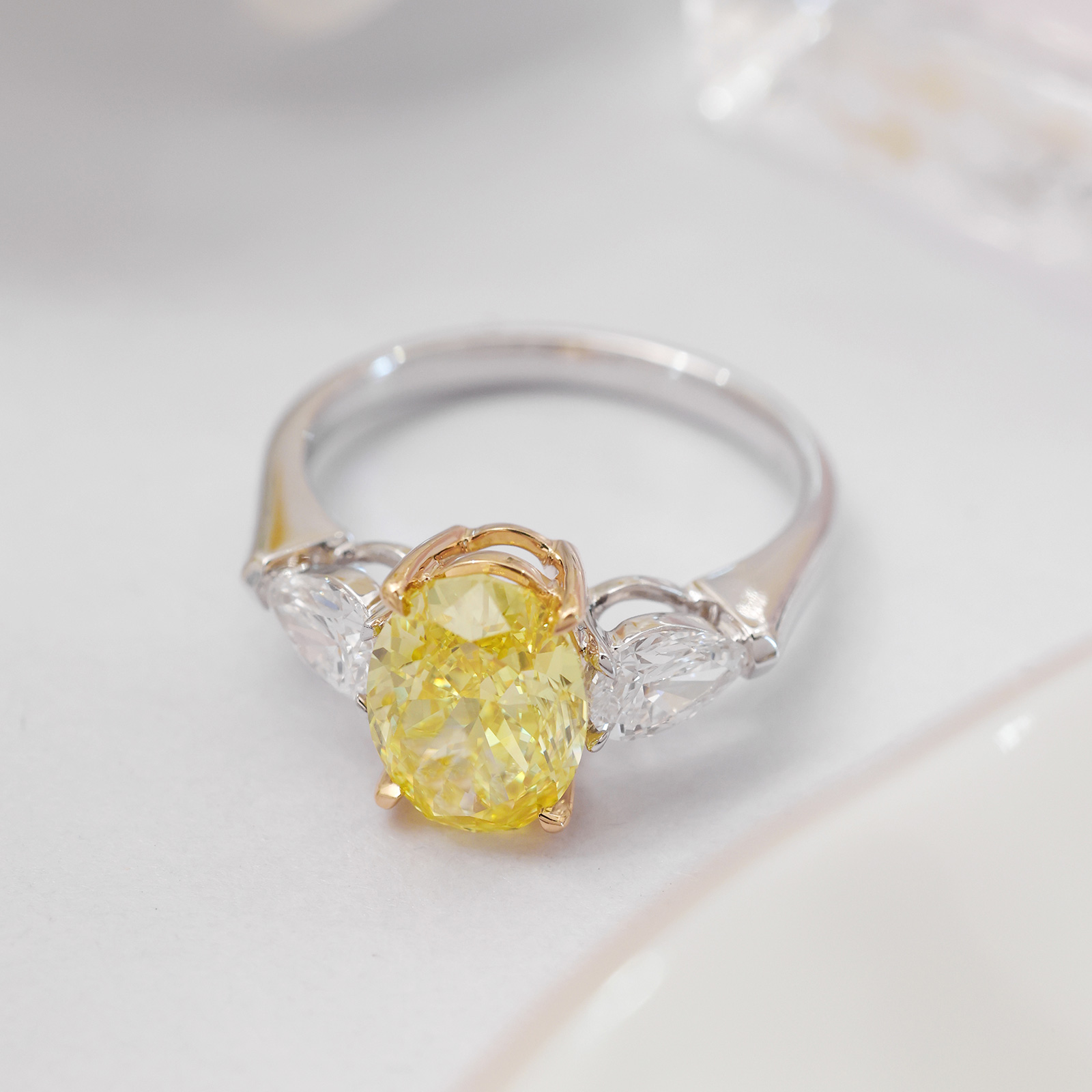 2.4 Carat Center Stone Yellow and White Oval Cut Three Stone Lab Grown Diamond Engagement Ring (3 Ct Tw)-Light Mark