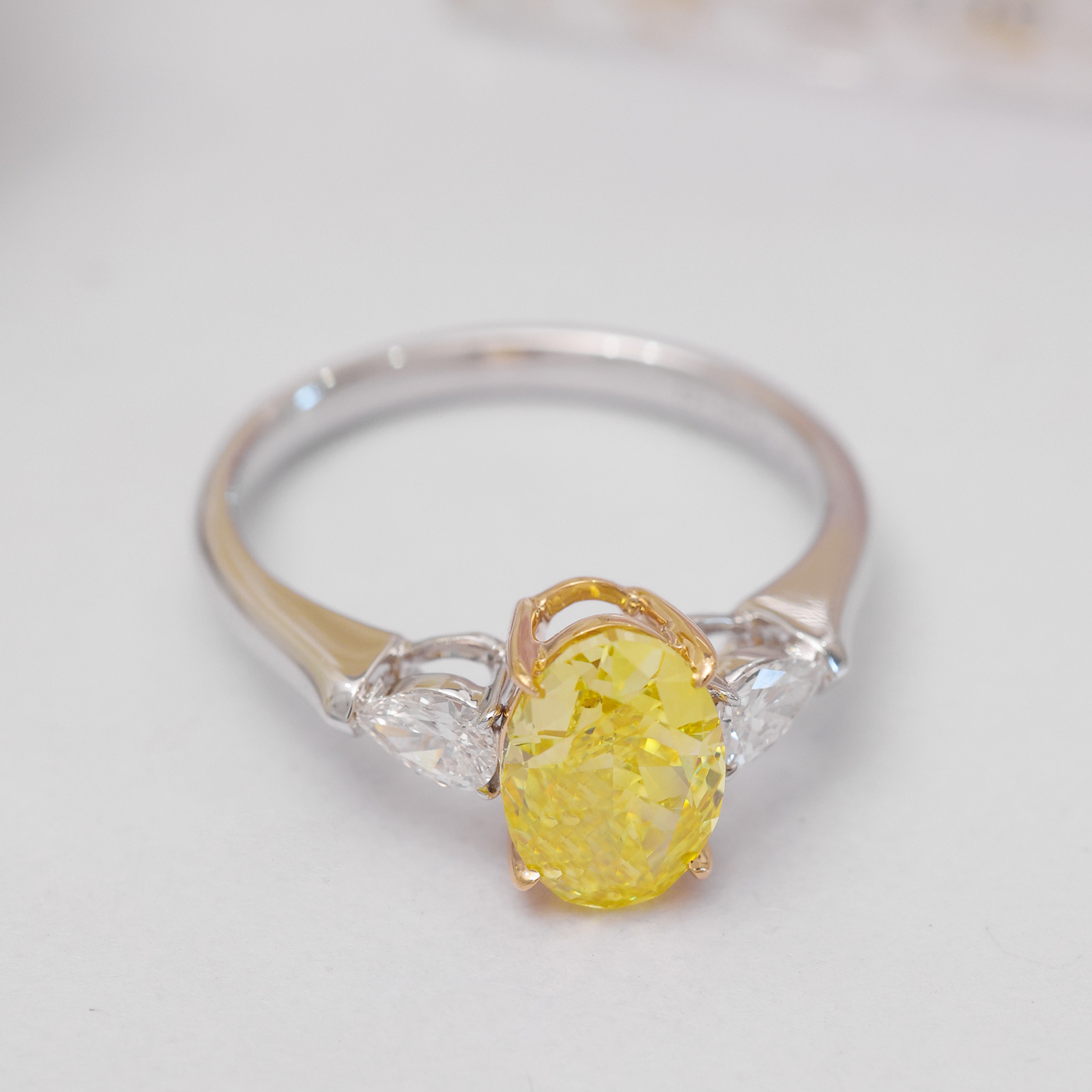 2.4 Carat Center Stone Yellow and White Oval Cut Three Stone Lab Grown Diamond Engagement Ring (3 Ct Tw)-Light Mark