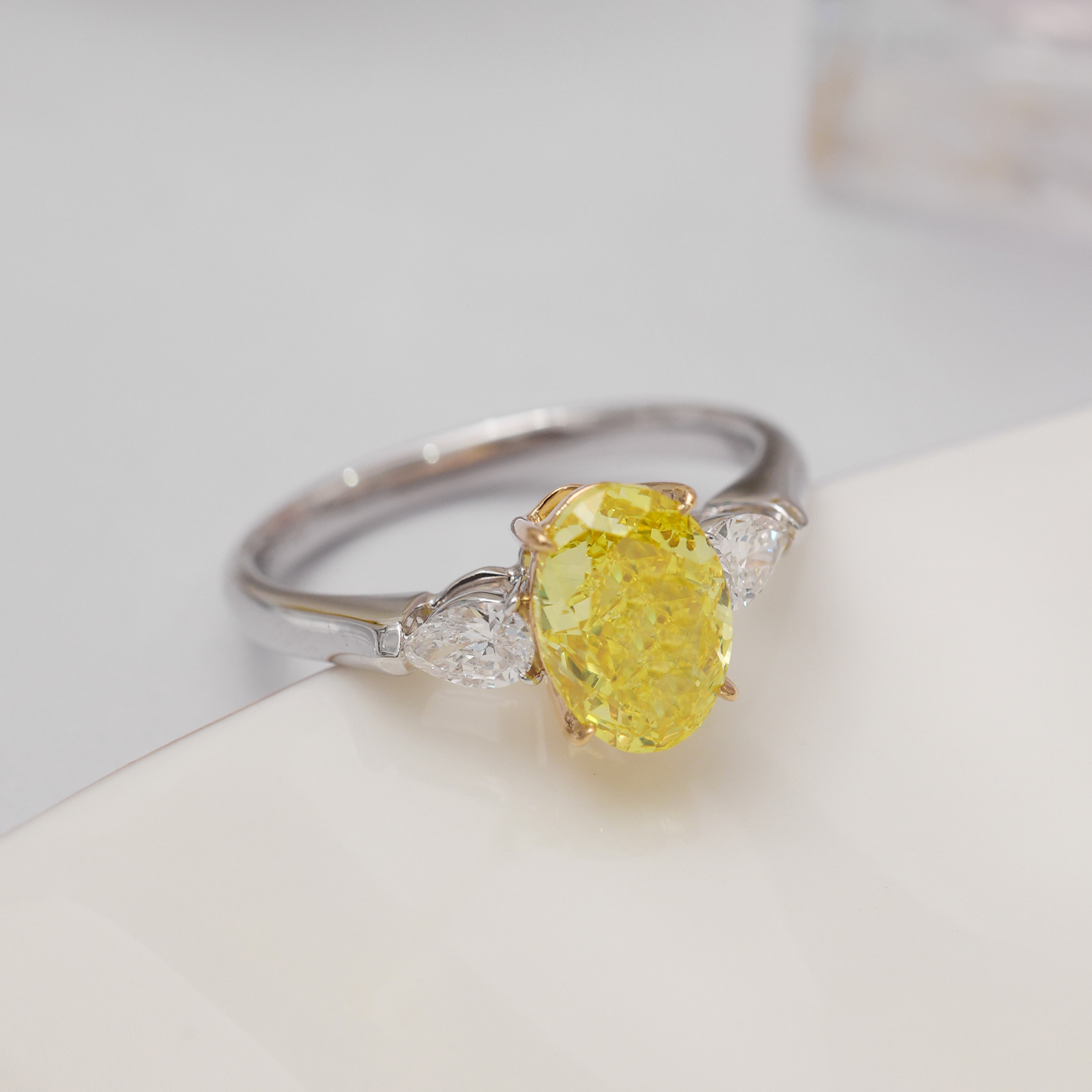 2.4 Carat Center Stone Yellow and White Oval Cut Three Stone Lab Grown Diamond Engagement Ring (3 Ct Tw)-Light Mark