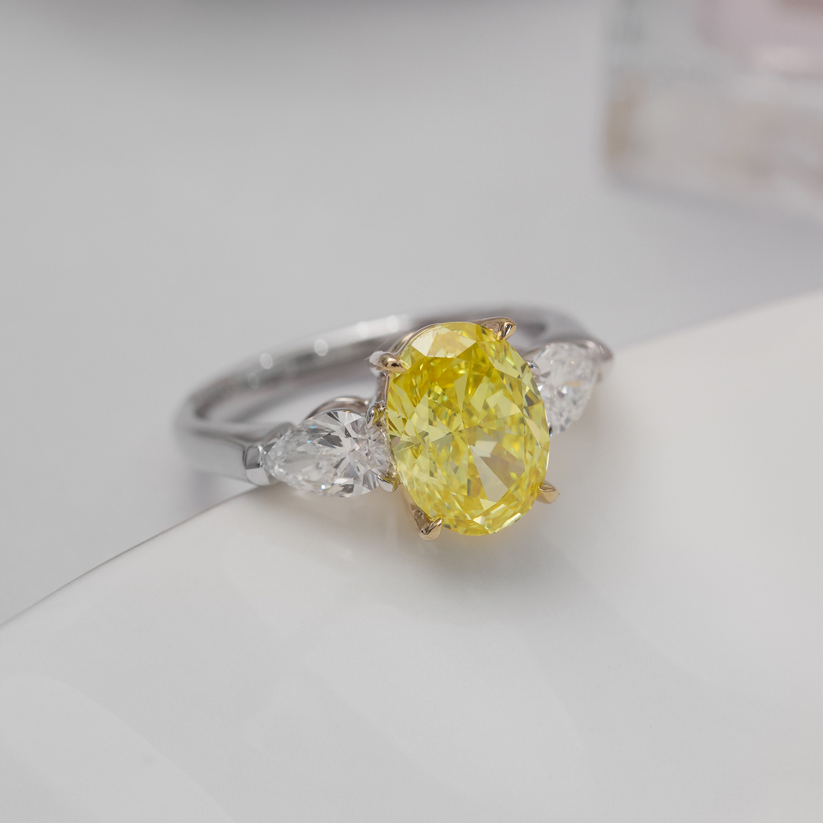 2.4 Carat Center Stone Yellow and White Oval Cut Three Stone Lab Grown Diamond Engagement Ring (3 Ct Tw)-Light Mark