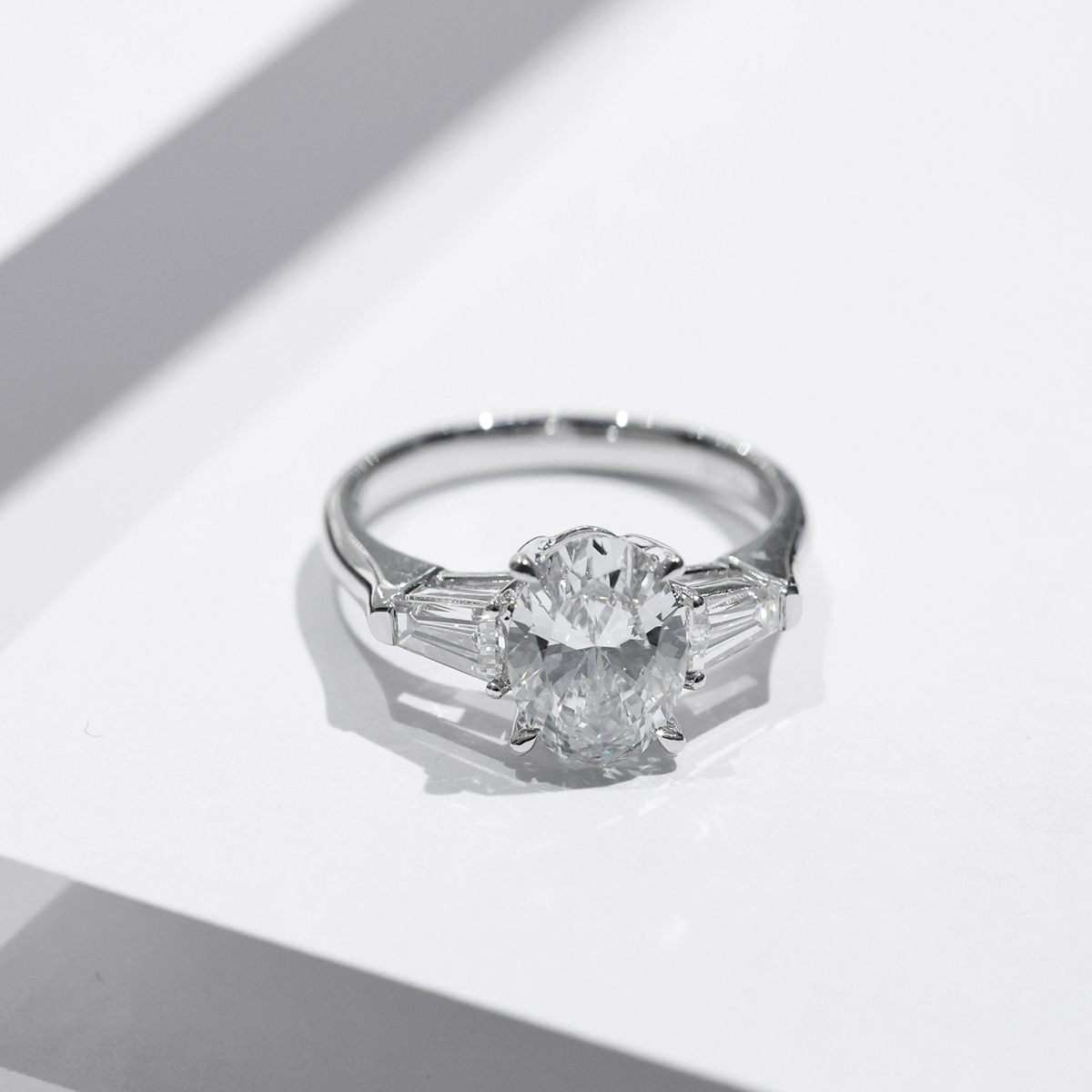 2.8 Ct. Tw. Oval Cut Lab Grown Diamond Modern Three Stone Design  Engagement Ring In 18k White Gold