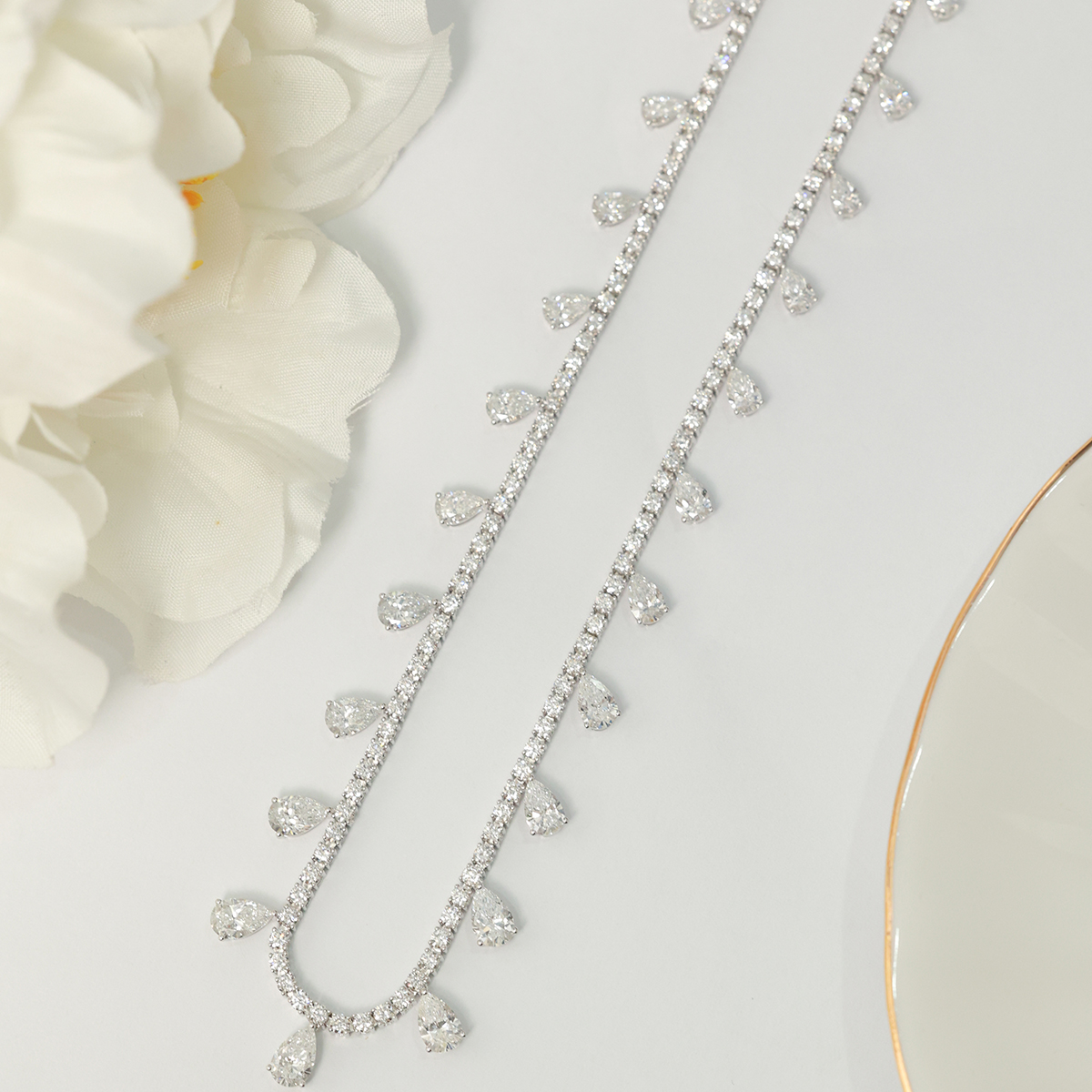 How to Master the Art of Jewelry Layering for a Sleek and Stylish Cocktail Party Look