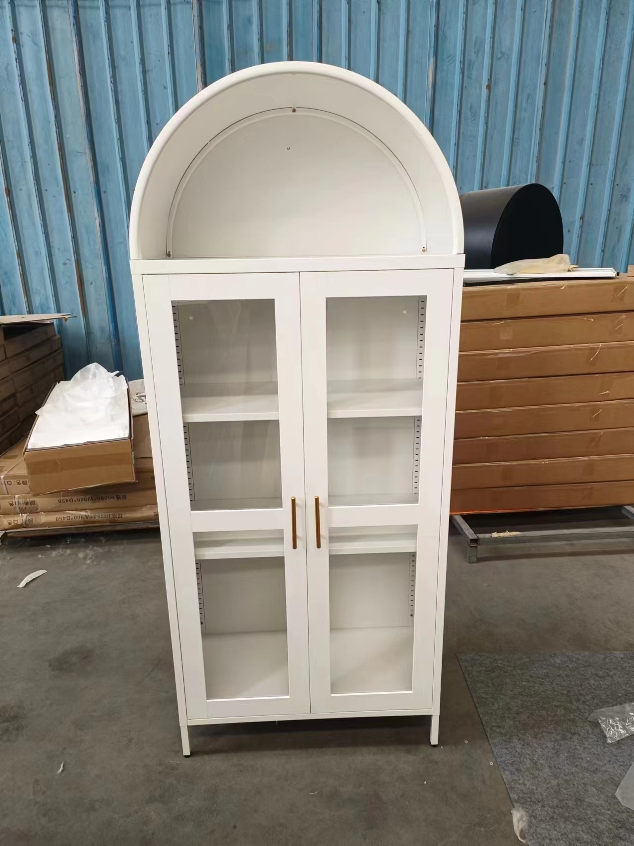 Arched cabinet with open doors