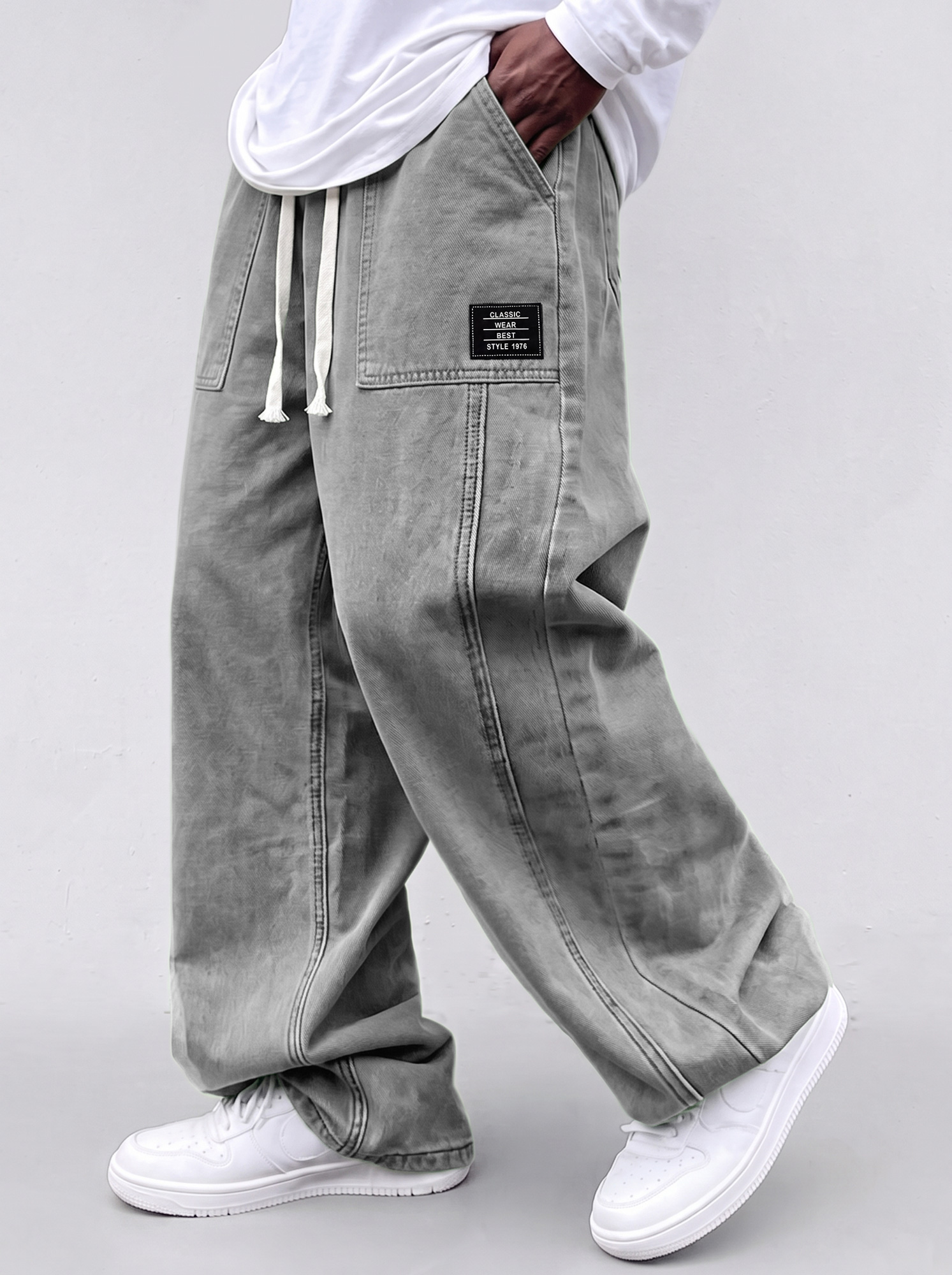 Men's casual straight-leg trousers with a deconstructed design and patch pockets.