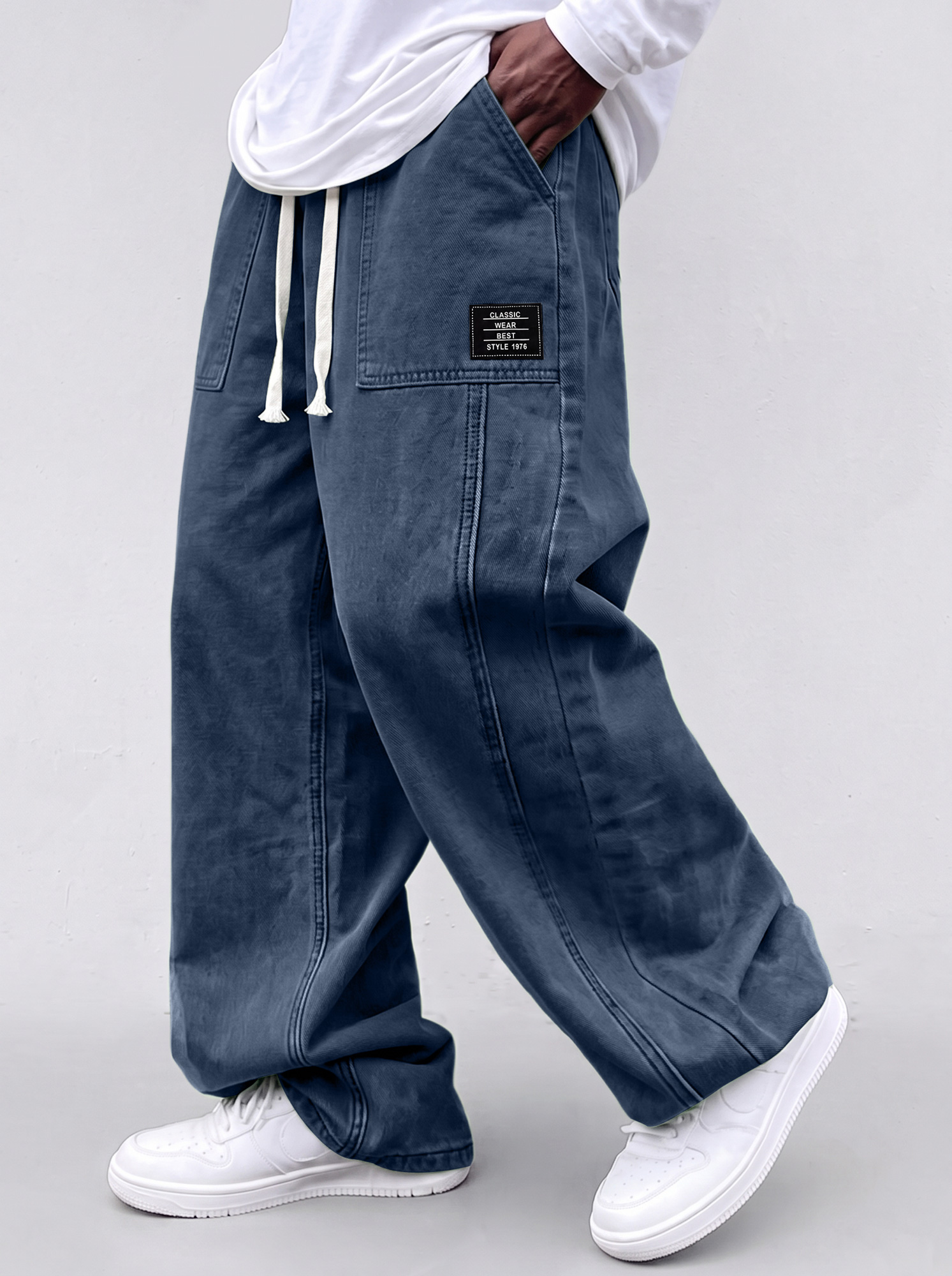 Men's casual straight-leg trousers with a deconstructed design and patch pockets.
