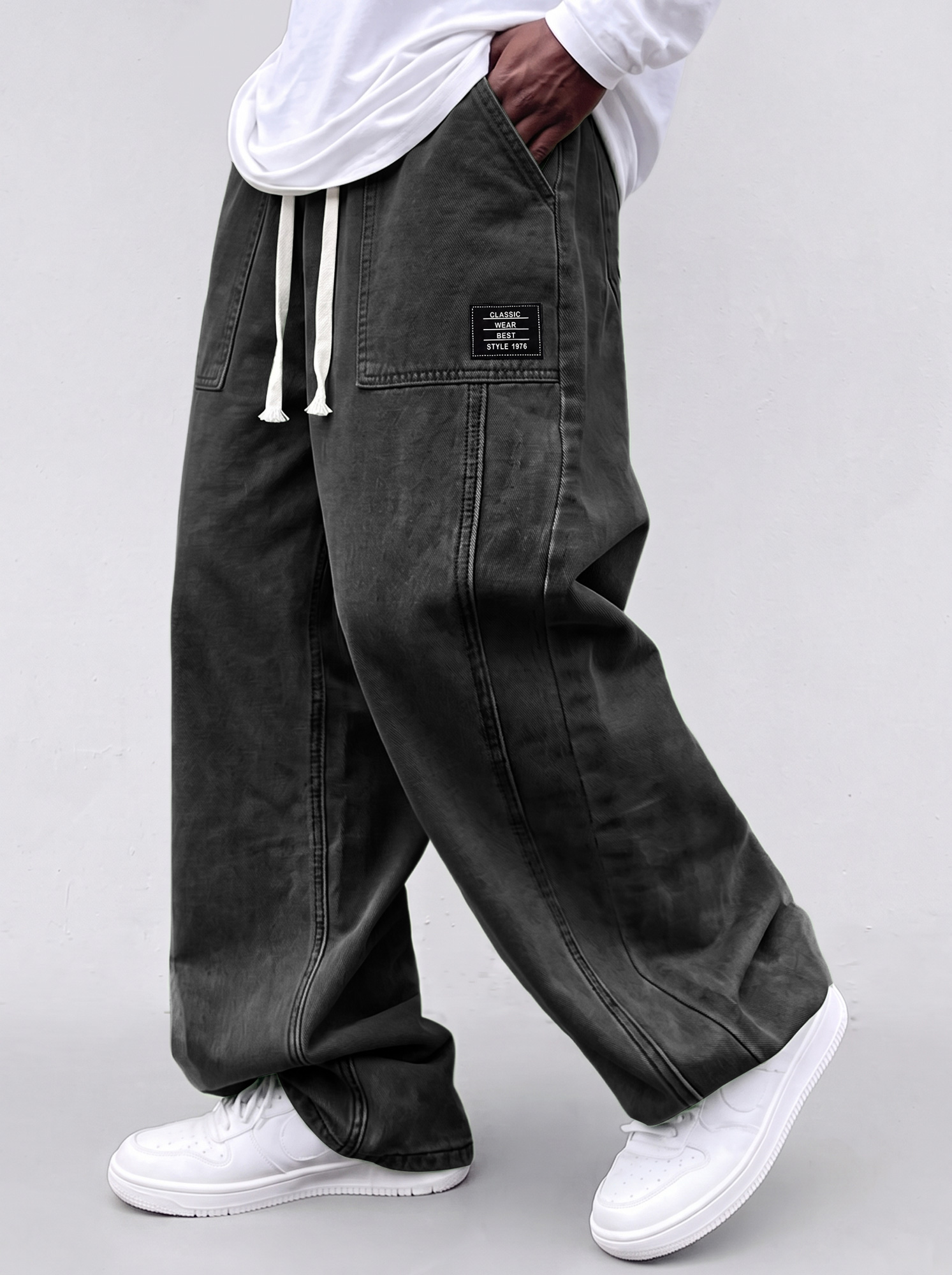 Men's casual straight-leg trousers with a deconstructed design and patch pockets.