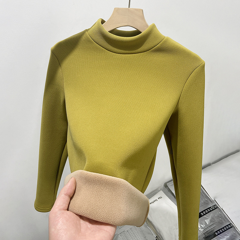 Layered with a half high neckline slim knit bottom sweater and plush warm top