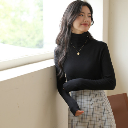 Long sleeved top with high collar on the outside and knitted sweater on the inside