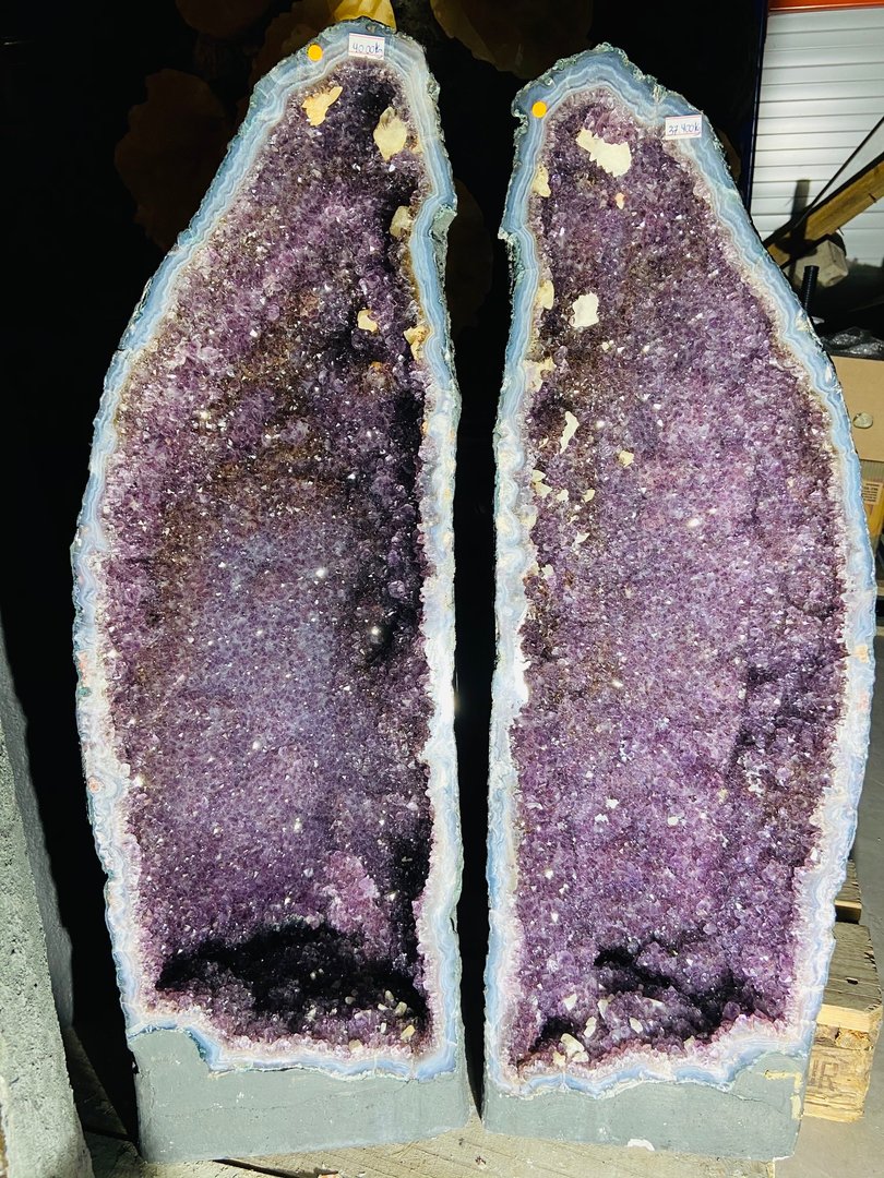 Amethyst druse pair with calcite crystals and smoky quartz veins theatee