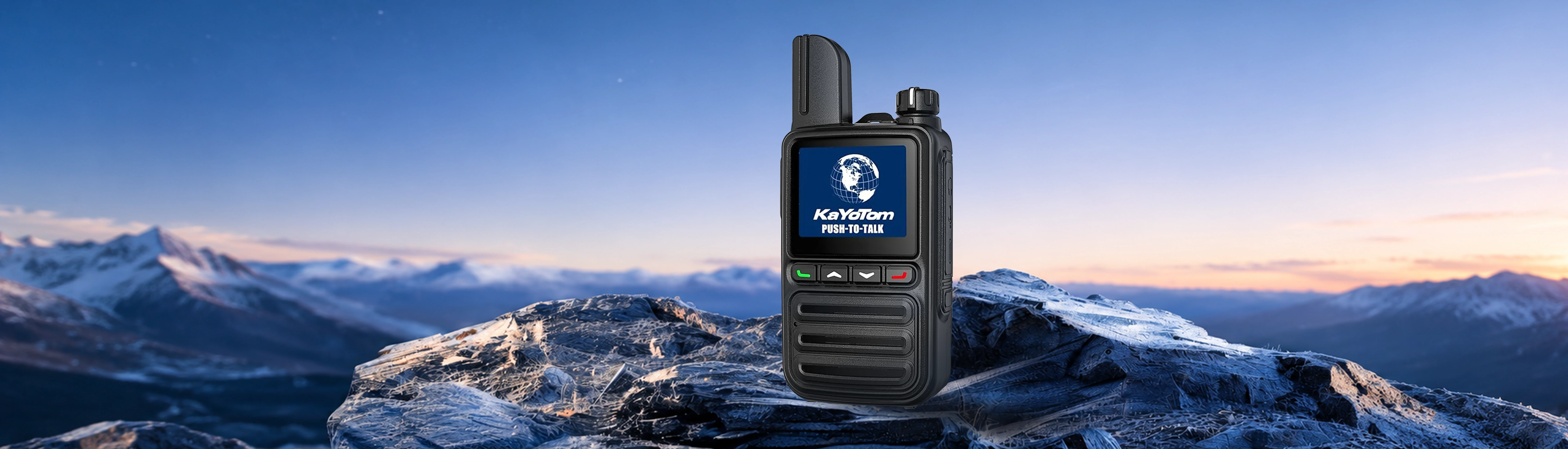 KayoTom G08 smart cellular two-way radio displayed on snowy mountain rocks with a sunrise landscape background