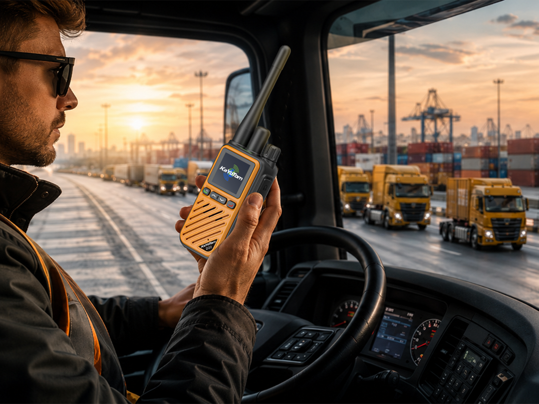 KaYoTom D22 Hybrid Dual-Mode Walkie-Talkie in use by a truck driver inside a cab, coordinating transport logistics with freight trucks on the highway in the background.