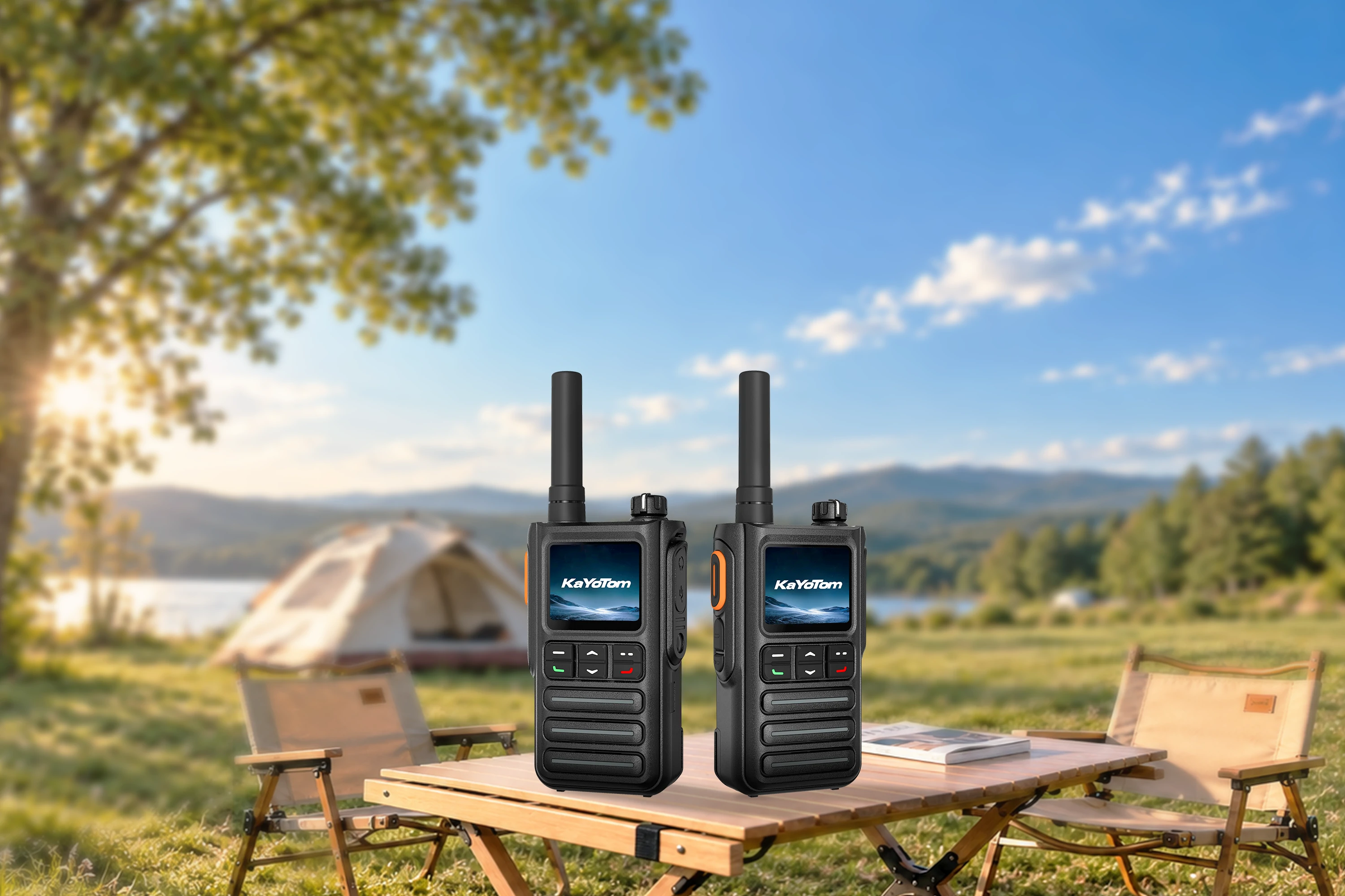 KayoTom G09 rugged dual two-way radios showcased on a wooden table with an outdoor camping and lake landscape background