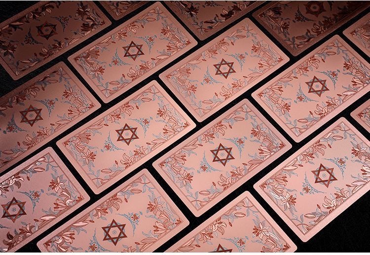 Front view of Neo Rider Tarot Deck with rose gold and black design