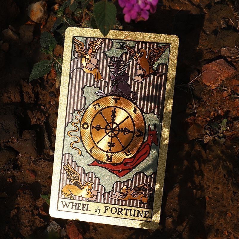 Front view of Neo Rider Tarot Deck with rose gold and black design