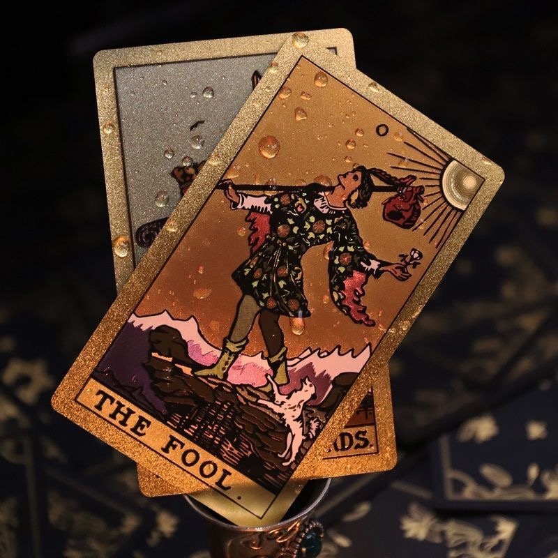 Front view of Neo Rider Tarot Deck with rose gold and black design