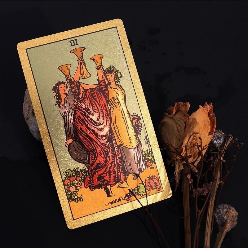 Front view of Neo Rider Tarot Deck with rose gold and black design