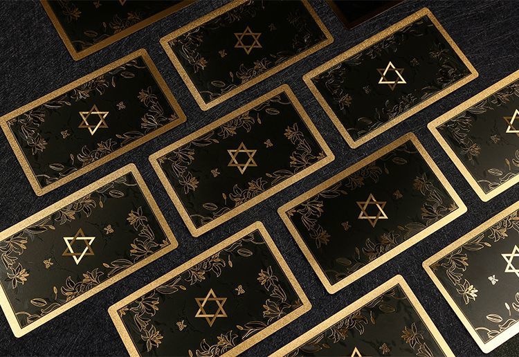 Front view of Neo Rider Tarot Deck with rose gold and black design