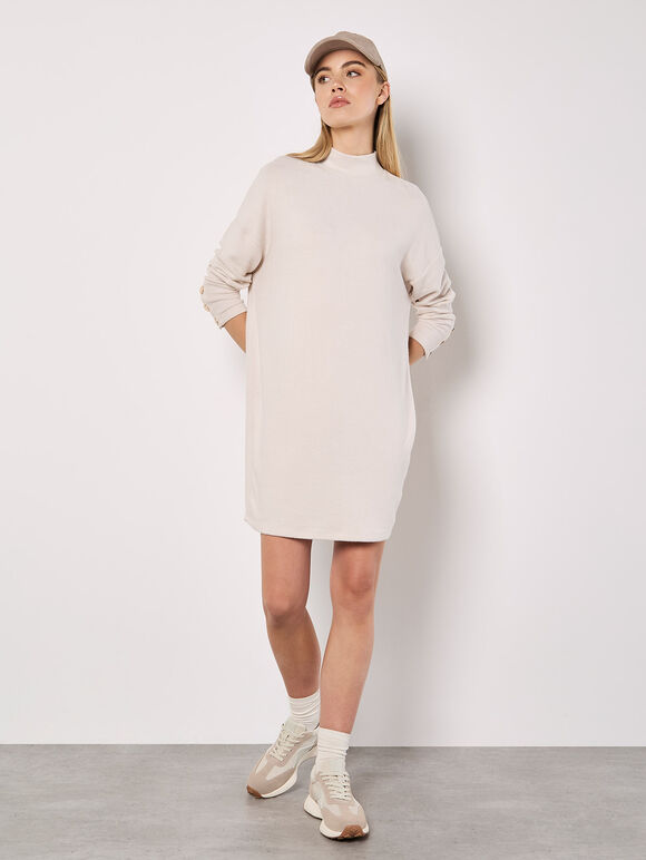 A soft-milky white, tubular-shaped mini knitted dress