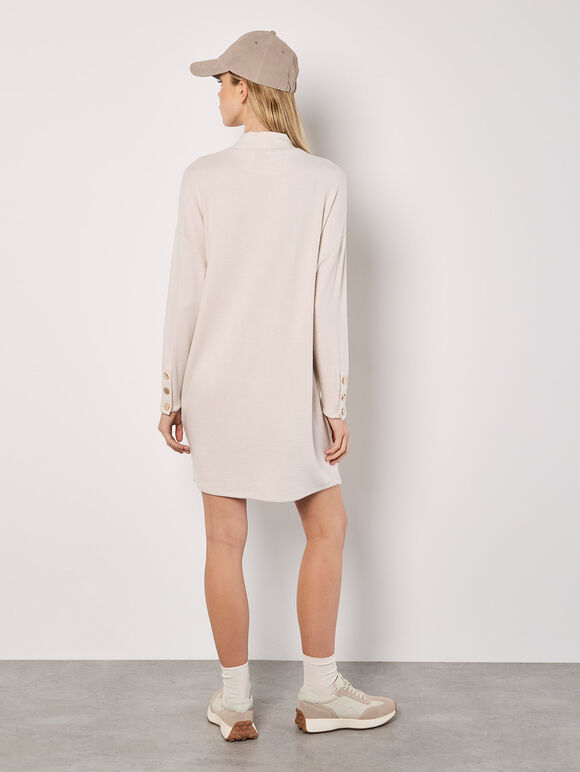 A soft-milky white, tubular-shaped mini knitted dress