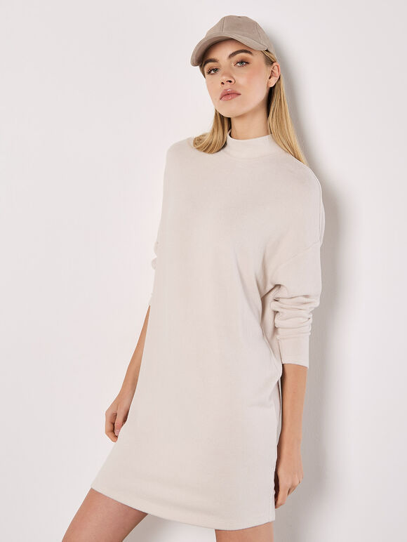 A soft-milky white, tubular-shaped mini knitted dress