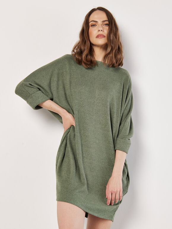 A greenish-brown knitted dress in a cocoon shape with ruffles along the edges